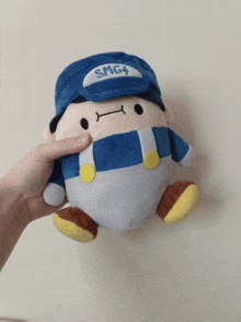 a person is holding a smg4 stuffed animal