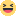 a blurred image of a smiley face with its mouth open and eyes closed .