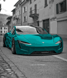 a turquoise tesla model s is parked on the side of the road