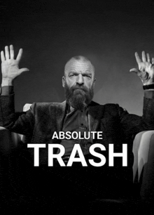 a man with a beard is on a poster that says trash