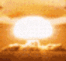 a nuclear bomb is exploding in the sky at sunset