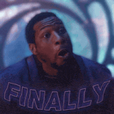 a man is wearing a shirt that says finally on it