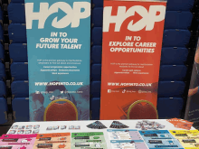 a table with a banner that says hop in to grow your future talent