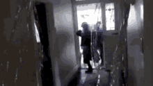 a blurred image of a person walking through a hallway