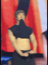 a blurry picture of a man with a very muscular torso