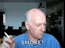 an older man is smoking a cigarette and asking if he should smoke ?