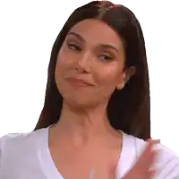 a woman wearing a white shirt is smiling and clapping