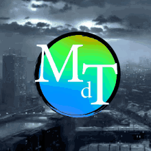 a colorful circle with the letters m and t on it