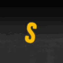 a yellow letter s is glowing in the dark