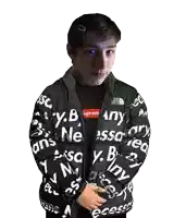 a young man wearing a jacket that says " any " on it