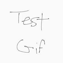 the word test is written in black marker on a white surface