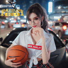 a girl holding a basketball with the word mix on her shirt