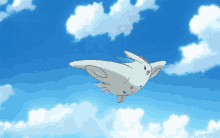 a cartoon pokemon is flying through a blue sky with clouds .