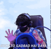 a man wearing headphones and a mask says kuch to gadbad hai daya ...