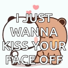a teddy bear is kissing another teddy bear on the cheek .
