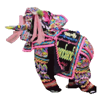 a colorful elephant with the word myanmar on the back of it