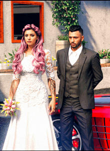 a man in a suit and a woman in a wedding dress are standing next to a red car