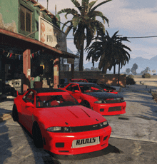 three red cars are parked in front of a building with a sign that says pisisse