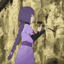 a girl in a purple dress is holding a hammer and has the letter p on her back