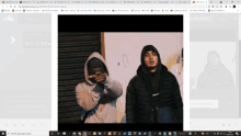 two men in hoodies are standing next to each other on a website