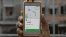 a person is holding a cell phone with a goride app on it