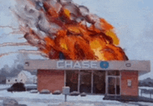 a chase bank is on fire with flames coming out of it