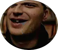 a close up of a man 's face with a tear running down his cheek