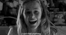 a black and white photo of a girl with the words " i can 't feel anything "