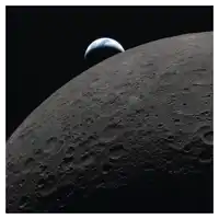 the earth is visible behind the moon in a black background