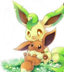 a couple of eevees sitting next to each other in a field .