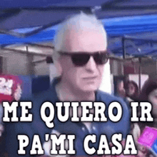 a man wearing sunglasses says me quiero ir pa ' mi casa .