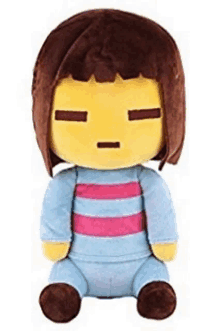 a stuffed toy of a girl with brown hair is sitting on a white surface .