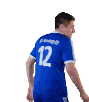 a man wearing a blue jersey with the number 12 on the back