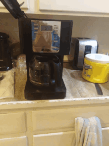 a mr coffee coffee maker sitting on a counter