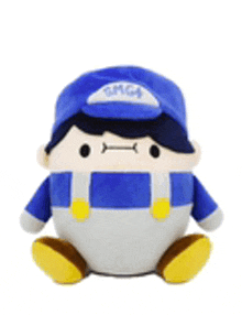 a stuffed toy of a man wearing a blue hat and overalls is sitting on a white surface .