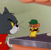 a cartoon of a cat and a mouse standing next to each other