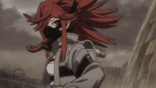 a girl with red hair is wearing a gas mask and giving a thumbs up sign