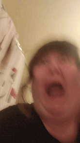 a blurry photo of a person making a funny face