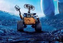 wall e from the movie wall e is standing on a rocky surface .