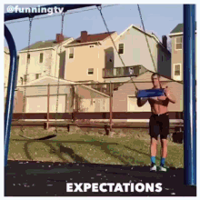 a shirtless man is standing on a swing with expectations written below him