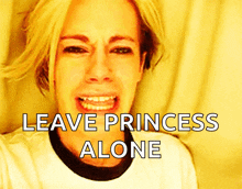 a woman is crying with the words " leave princess alone " behind her