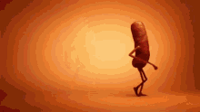 a sausage with arms and legs is dancing on a yellow background .