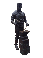 a bronze statue of a blacksmith with a hammer and anvil