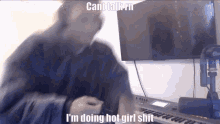 a blurry picture of a man playing a keyboard with a caption that says cant talkin i 'm doing hot girl shit