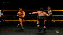 two men in a wrestling ring with a referee in the background and the words rawnext on the bottom