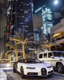 a bugatti chiron is parked next to a mercedes benz g63