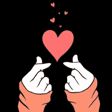 a pair of hands making a heart shape with their fingers