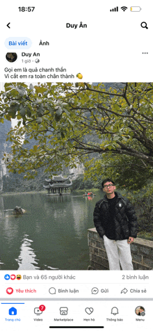 a screenshot of a facebook page shows a man standing next to a lake