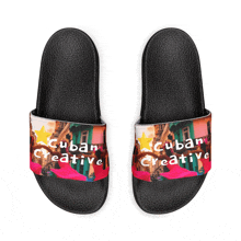 a pair of black sandals with cuban creative written on them