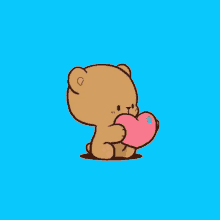 a cartoon teddy bear is holding a pink heart in his mouth .